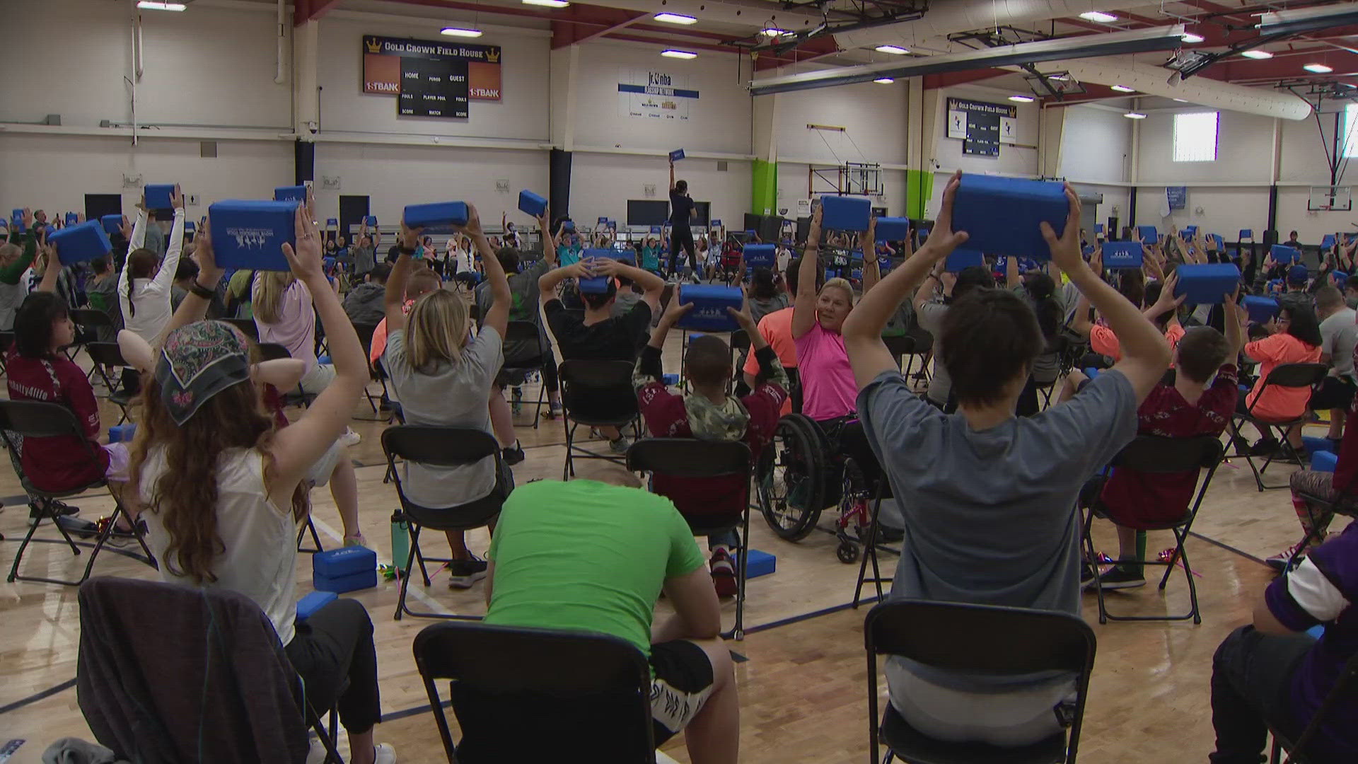 Students with intellectual, developmental, and physical disabilities, along with their peer helpers and teachers participated in an adaptive yoga class.