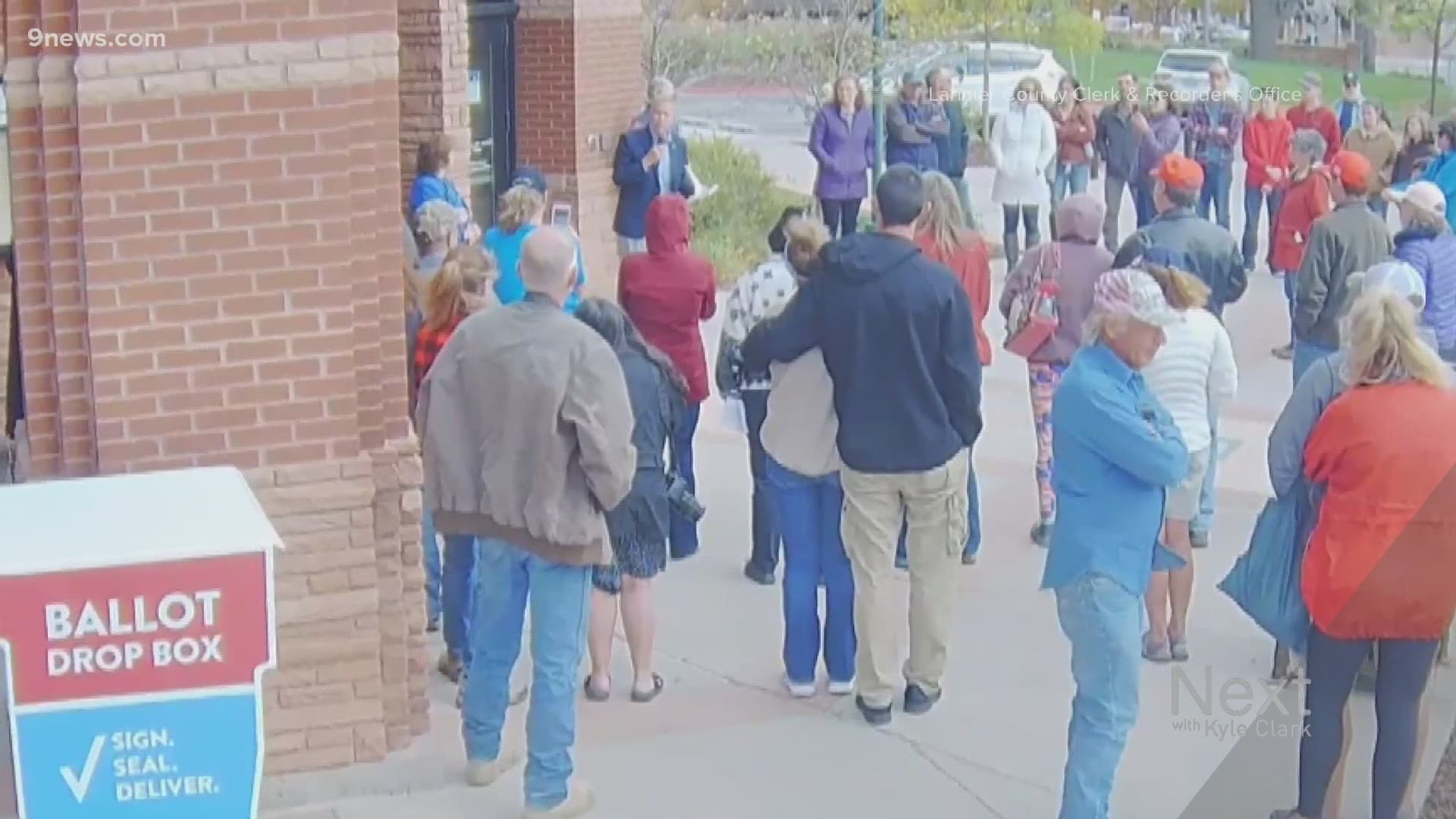 A group gathered over the weekend to protest Colorado's mask mandate and business restrictions near a ballot drop box in Larimer County.