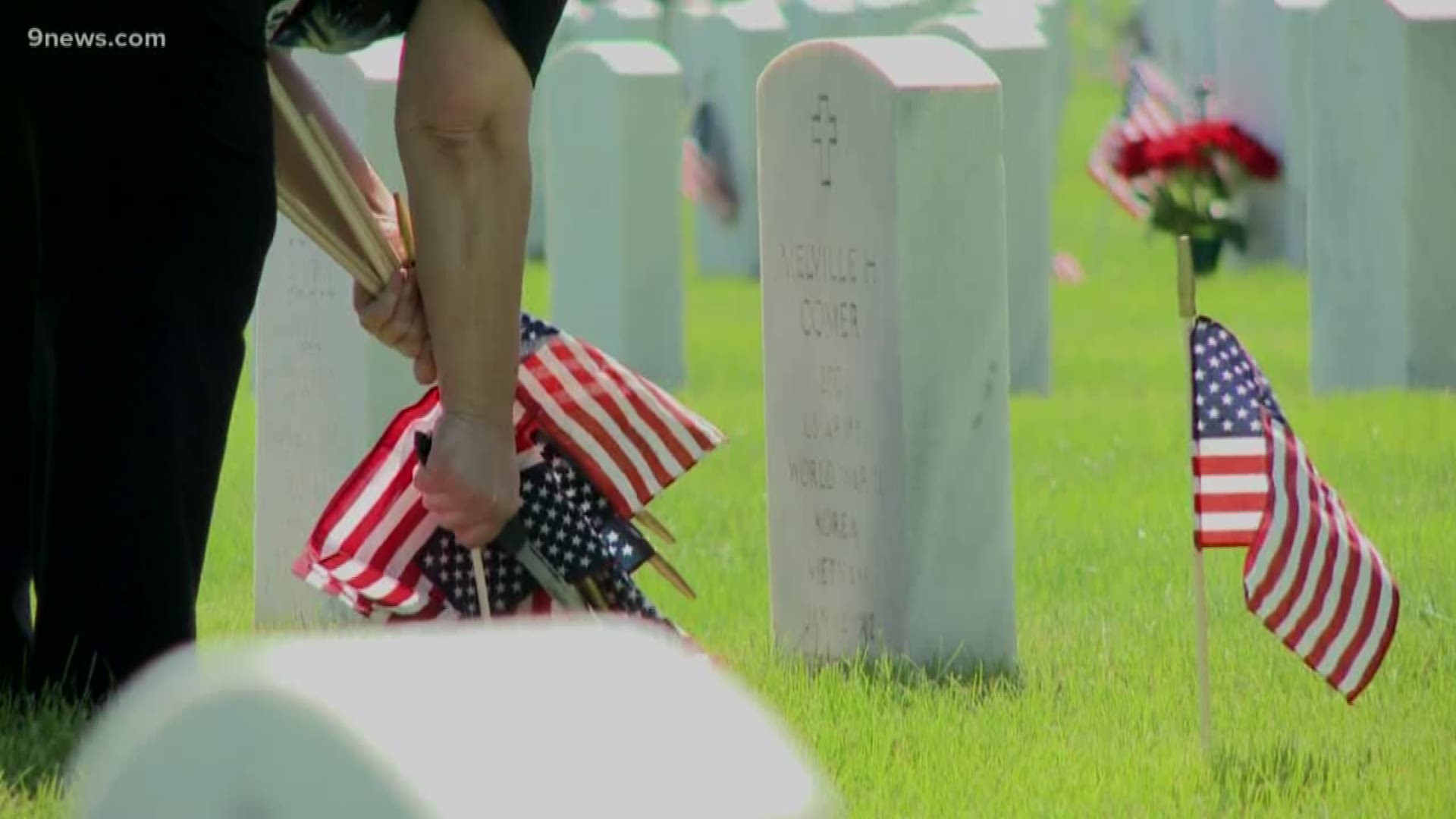 Volunteers spent part of their Sunday honoring memorial day at Fort Logan National Cemetery.
