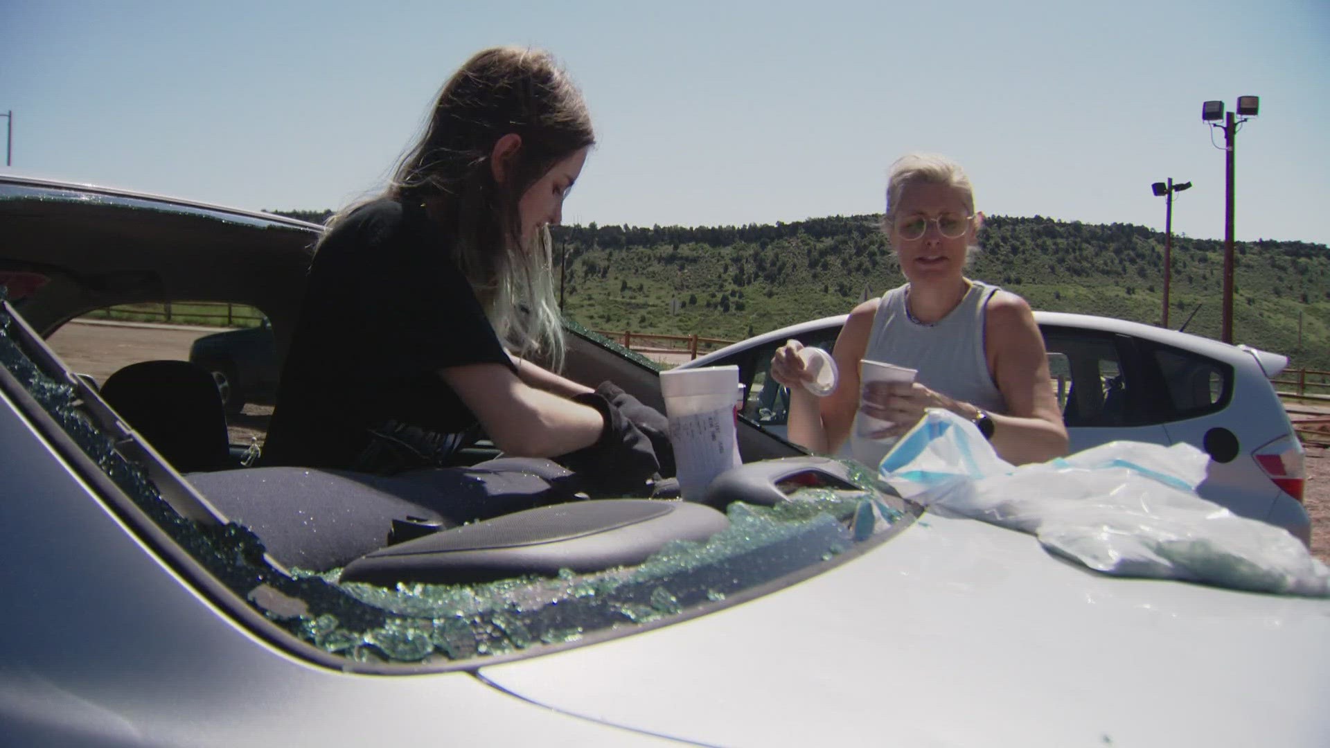 A concertgoer's car at Red Rocks Amphitheater was damaged after a massive hail storm swept through Colorado Wednesday night