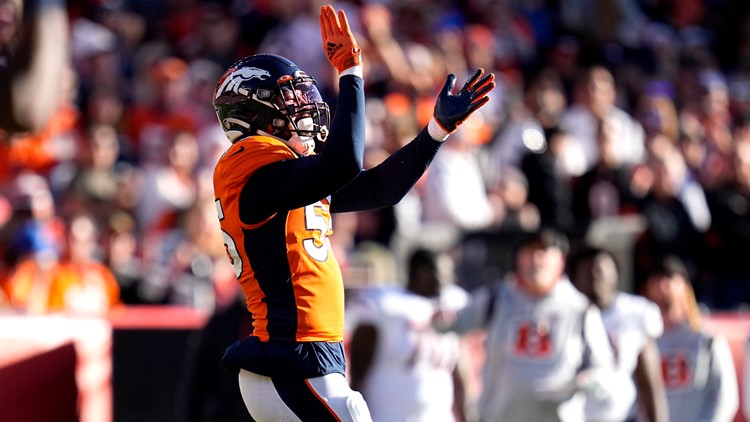 Cincinnati Bengals quarterback Joe Burrow (9) smiles post game against the  Denver Broncos in the second half of an NFL football game Sunday, Dec 19,  2021, in Denver. (AP Photo/Bart Young Stock