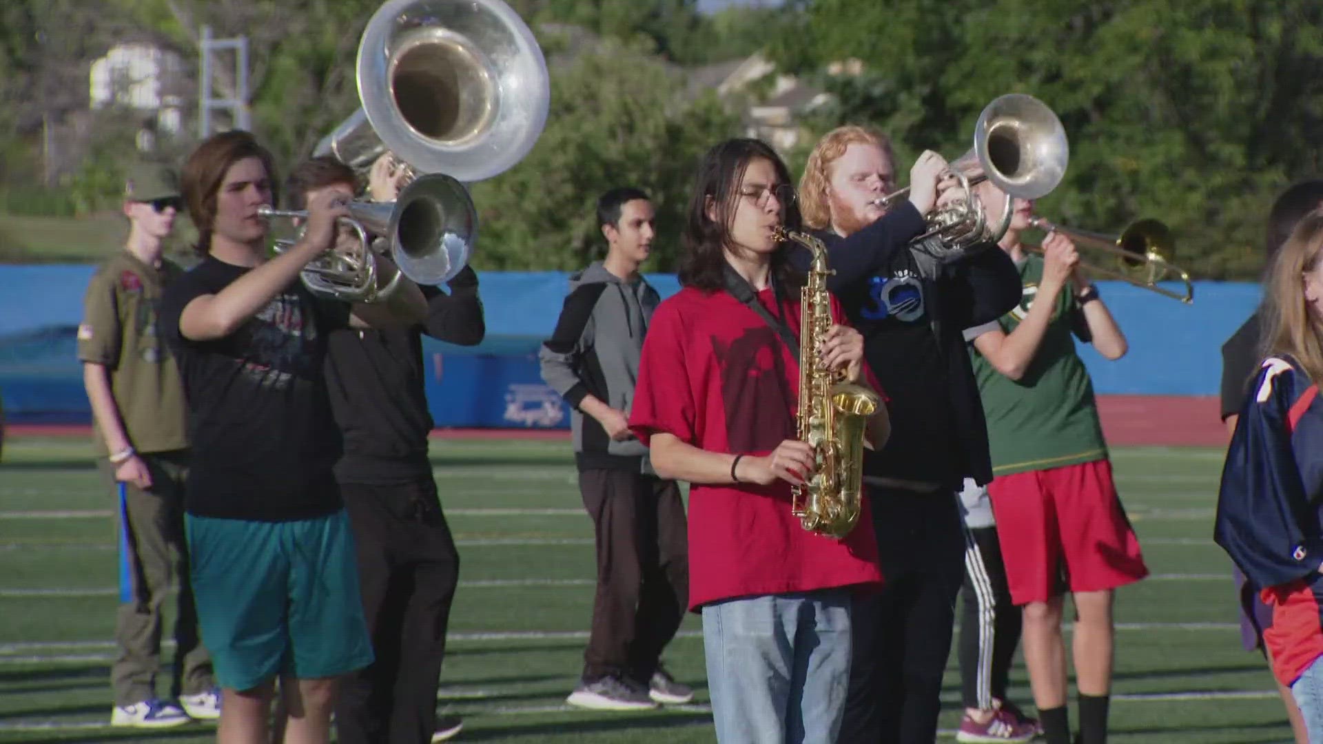 Community members— from college professors to professional musicians— are helping Broomfield High School's marching band with their sound.