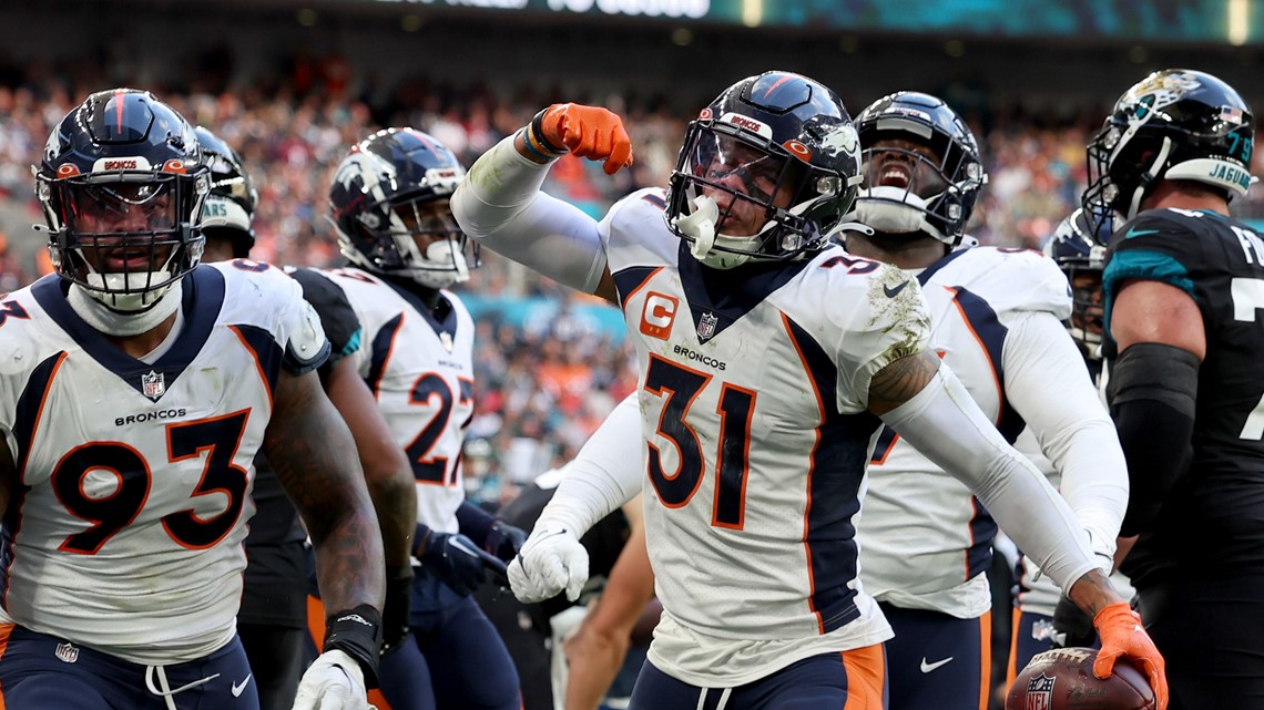 Denver Broncos orange-blue stripe uniform combo returns vs Titans