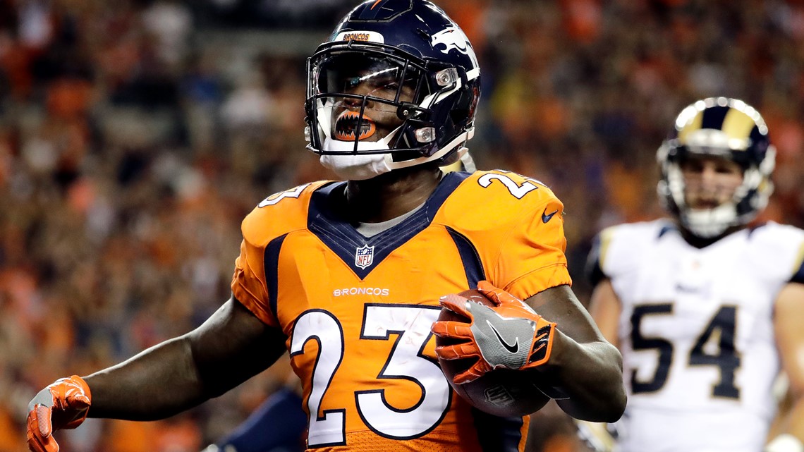 A Salute to Service military logo is seen on the helmet of Denver Broncos'  Ronnie Hillman before the start of an NFL football game against the  Indianapolis Colts, Sunday, Nov. 8, 2015