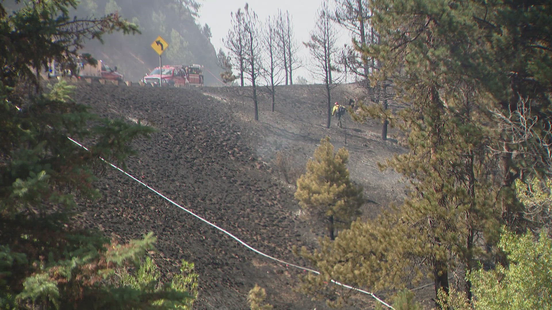 Five homes were evacuated and a portion of Highway 285 was closed due to a wildfire in the Indian Hills area of Jefferson County on Sunday.