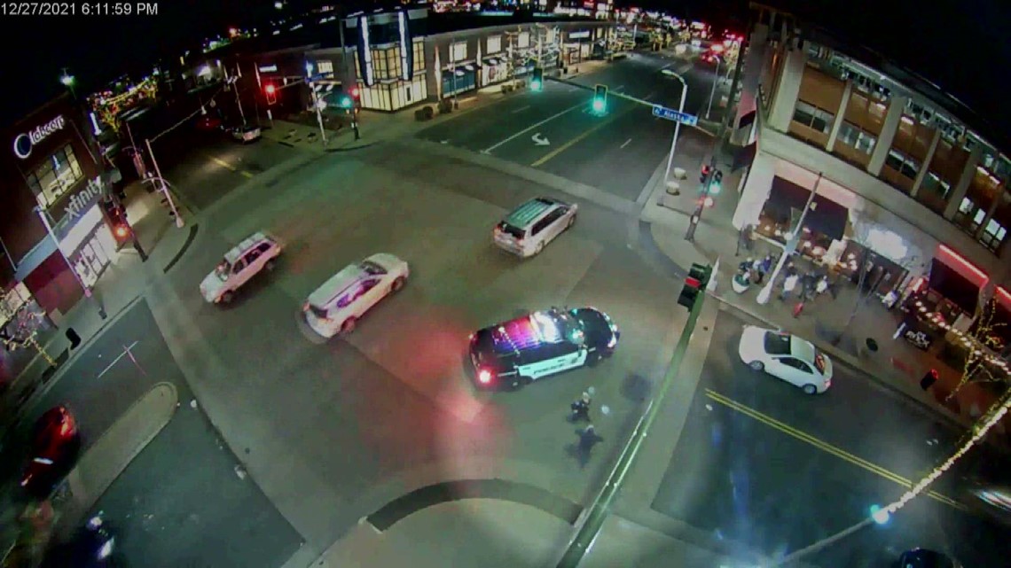 Surveillance video shows injured police officer shoot suspect accused