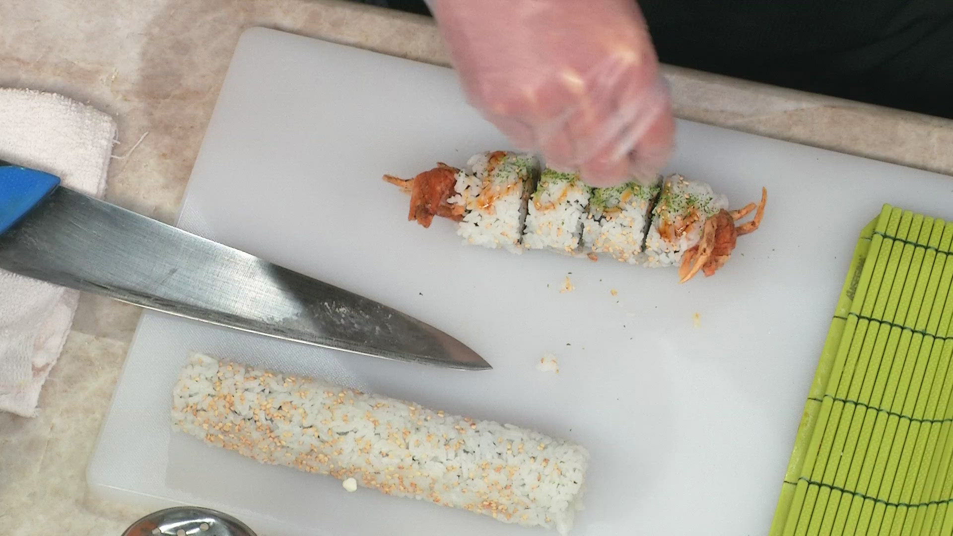 Masaru Torito and Kevin Bollom from Kokoro show 9NEWS anchor Alexandra Lewis how to make sushi as Mile High Asian Food Weekend comes to an end.