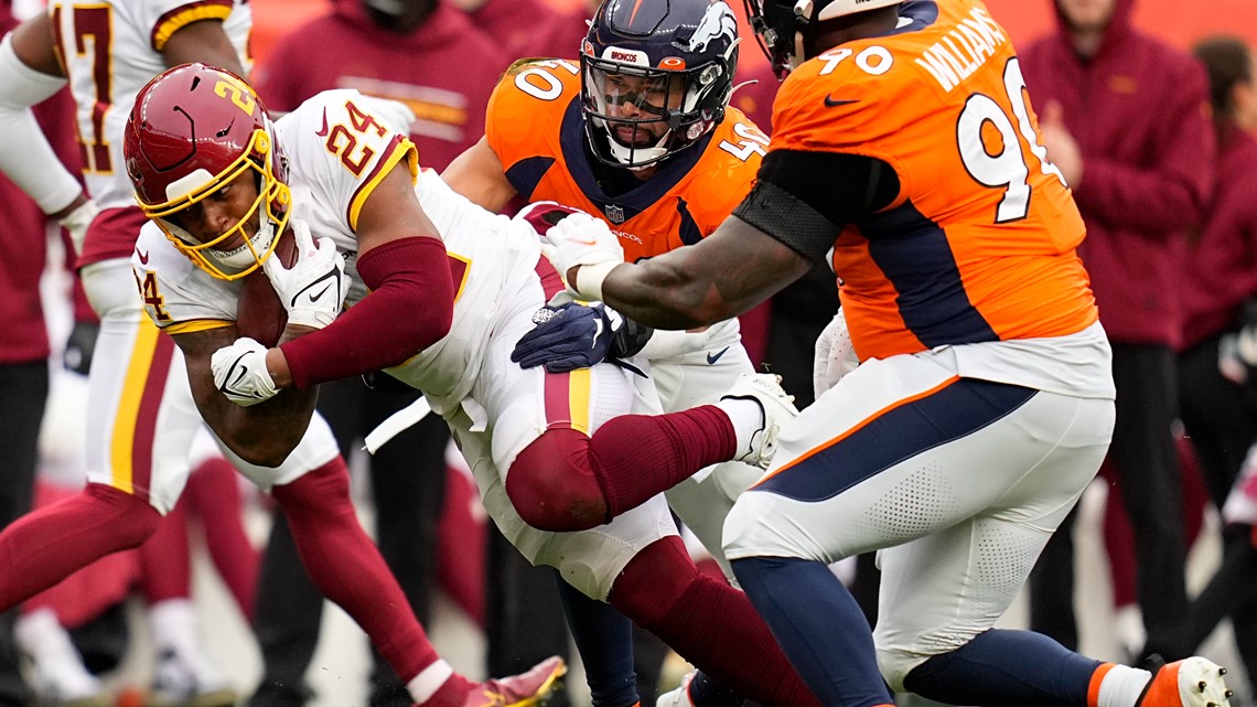 Washington Football Team defensive end Chase Young (99) warms up against  the Denver Broncos in the first half of an NFL football game Sunday, Oct.  31, 2021, in Denver. (AP Photo/Bart Young