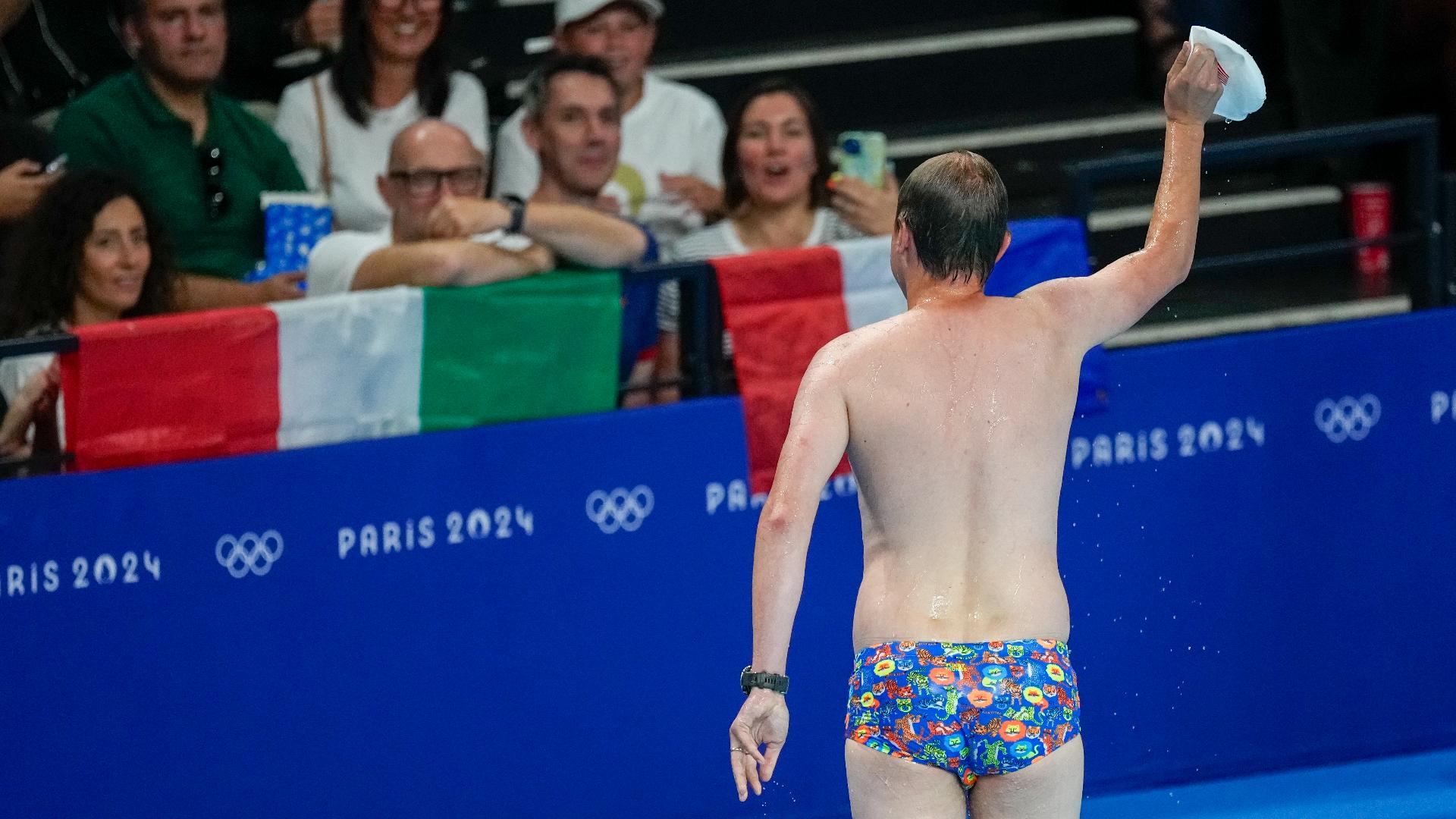 Sjim Py Pool worker in skimpy suit cheered after retrieving cap from pool ...