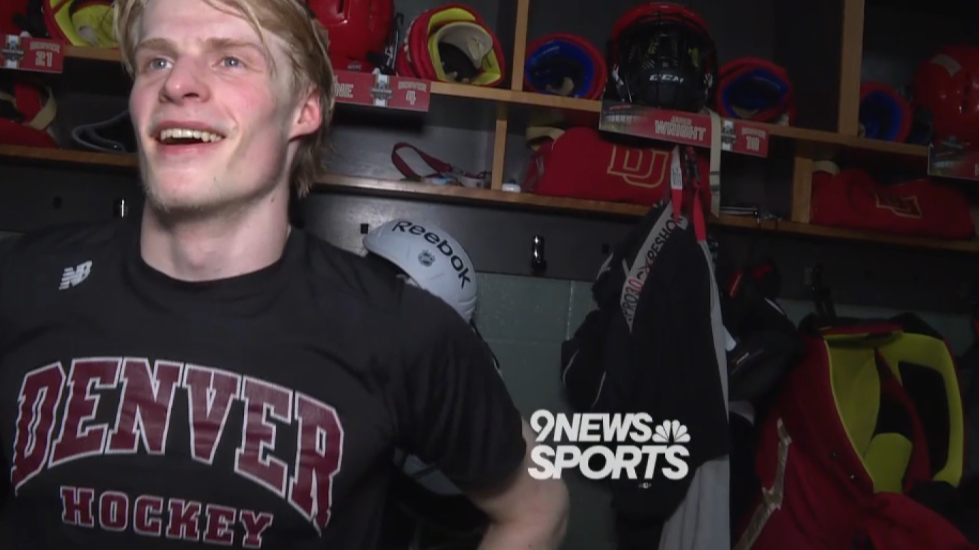 Players of the Pioneers' hockey team react to their Frozen Four win over Boston University.