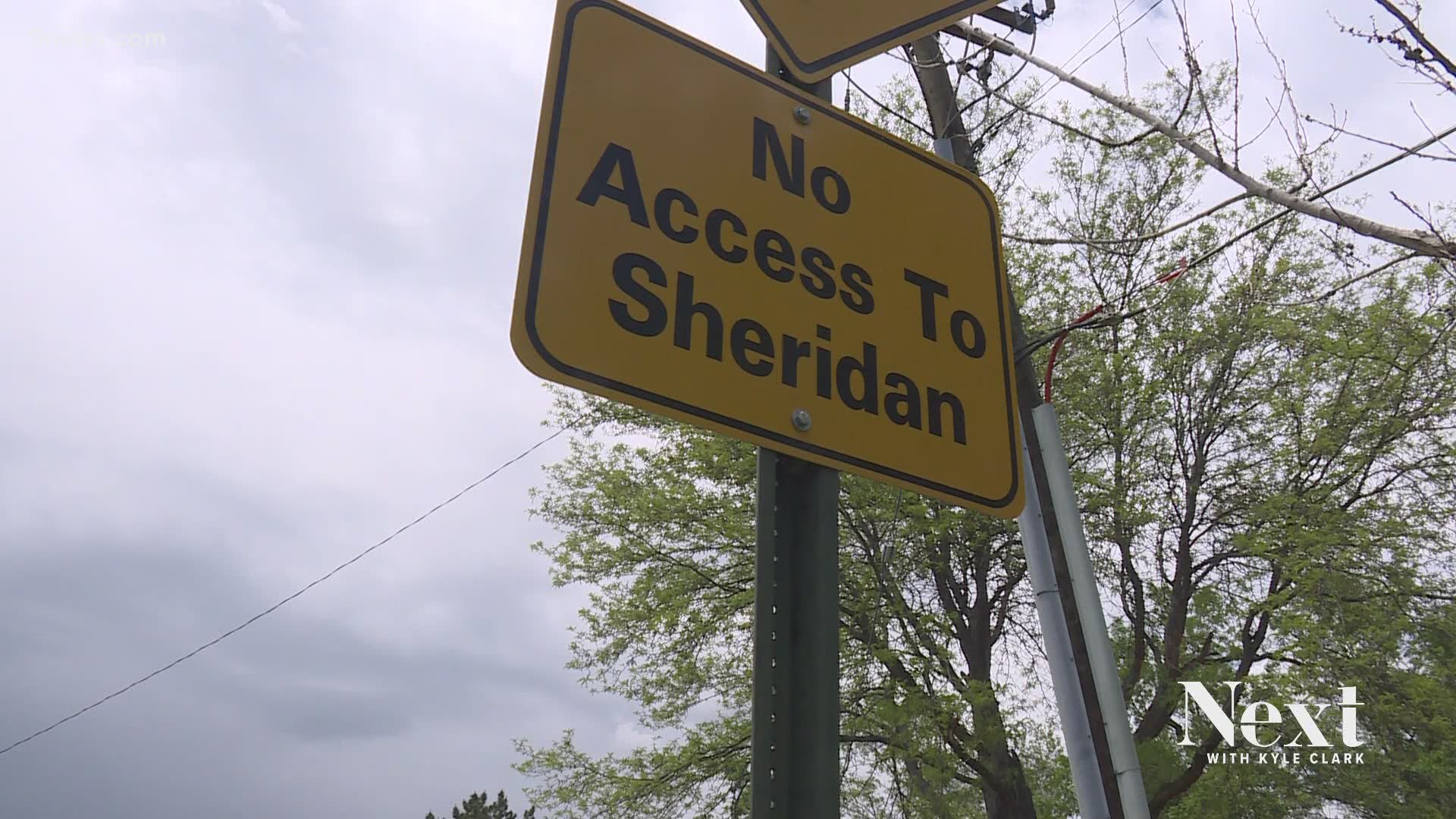 Someone in the town of Bow Mar has some explaining to do about this "no access to Sheridan" sign, because this road totally has access to Sheridan.