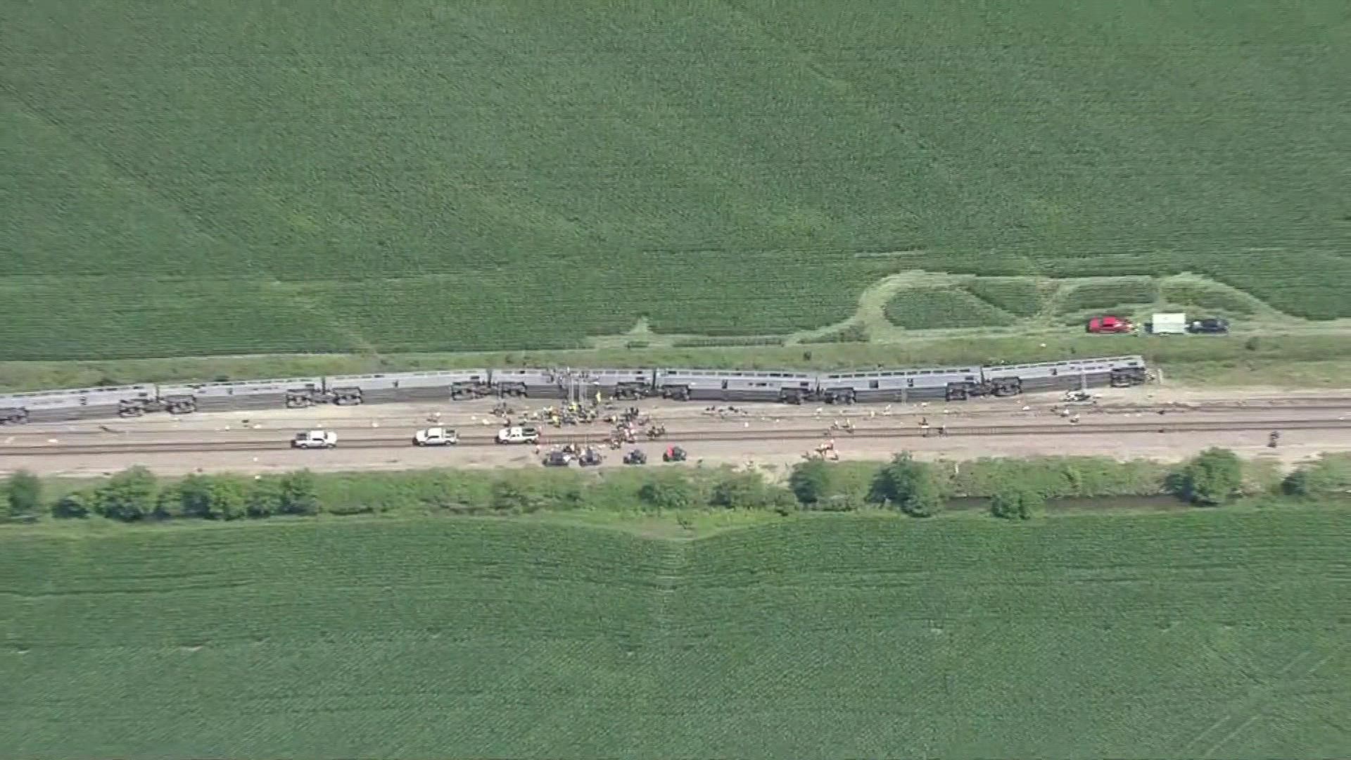 Aerials show Amtrak train derailment after crash with dump truck in Mendon, Missouri, Monday.