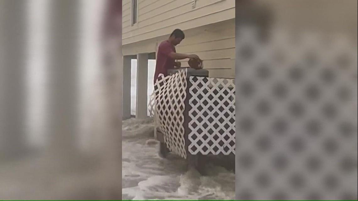 Video captures man rescuing cat during Hurricane Ian