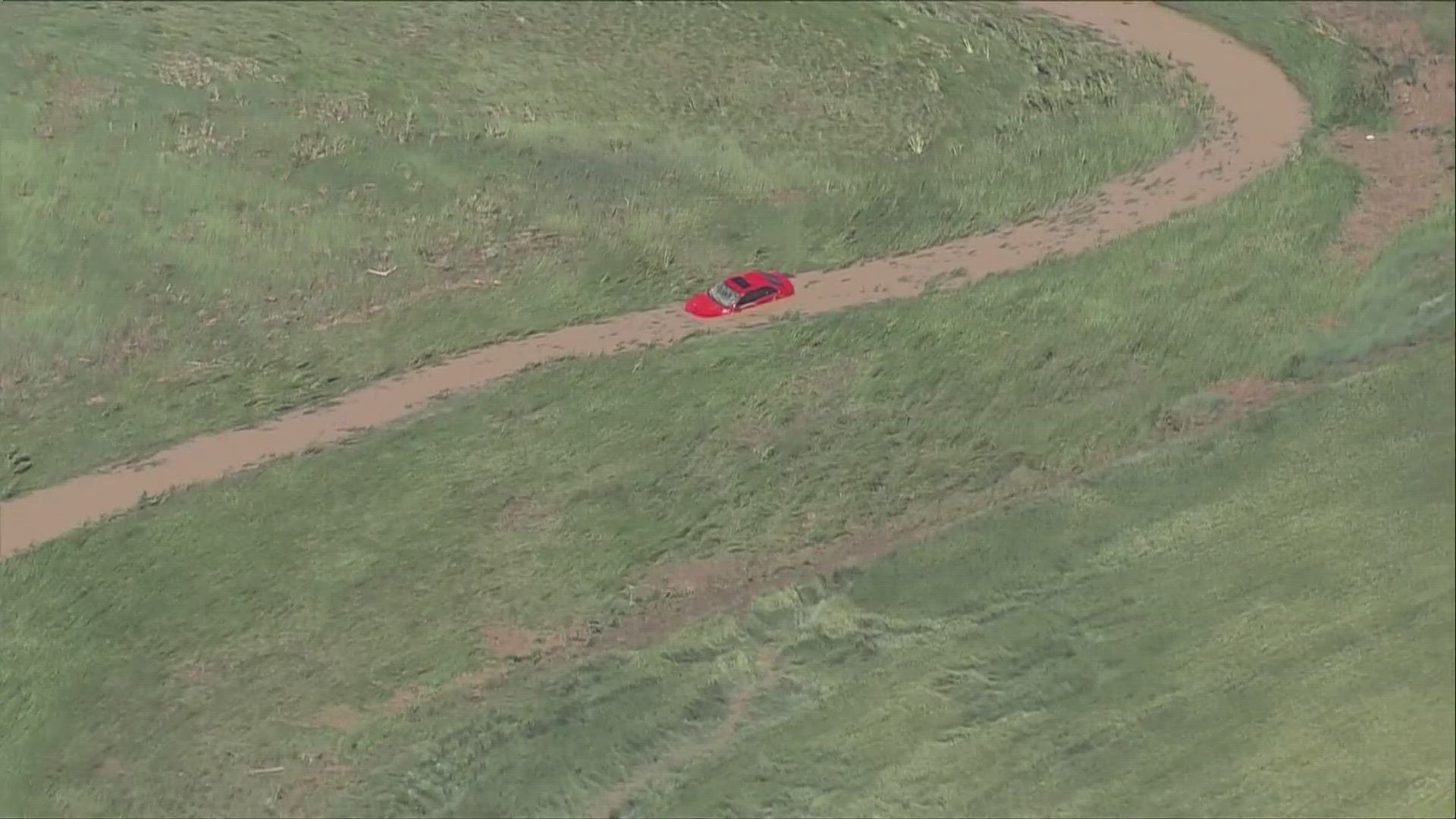 A woman has died after her car was swept off a highway about 20 miles east of Denver after thunderstorms Wednesday night.