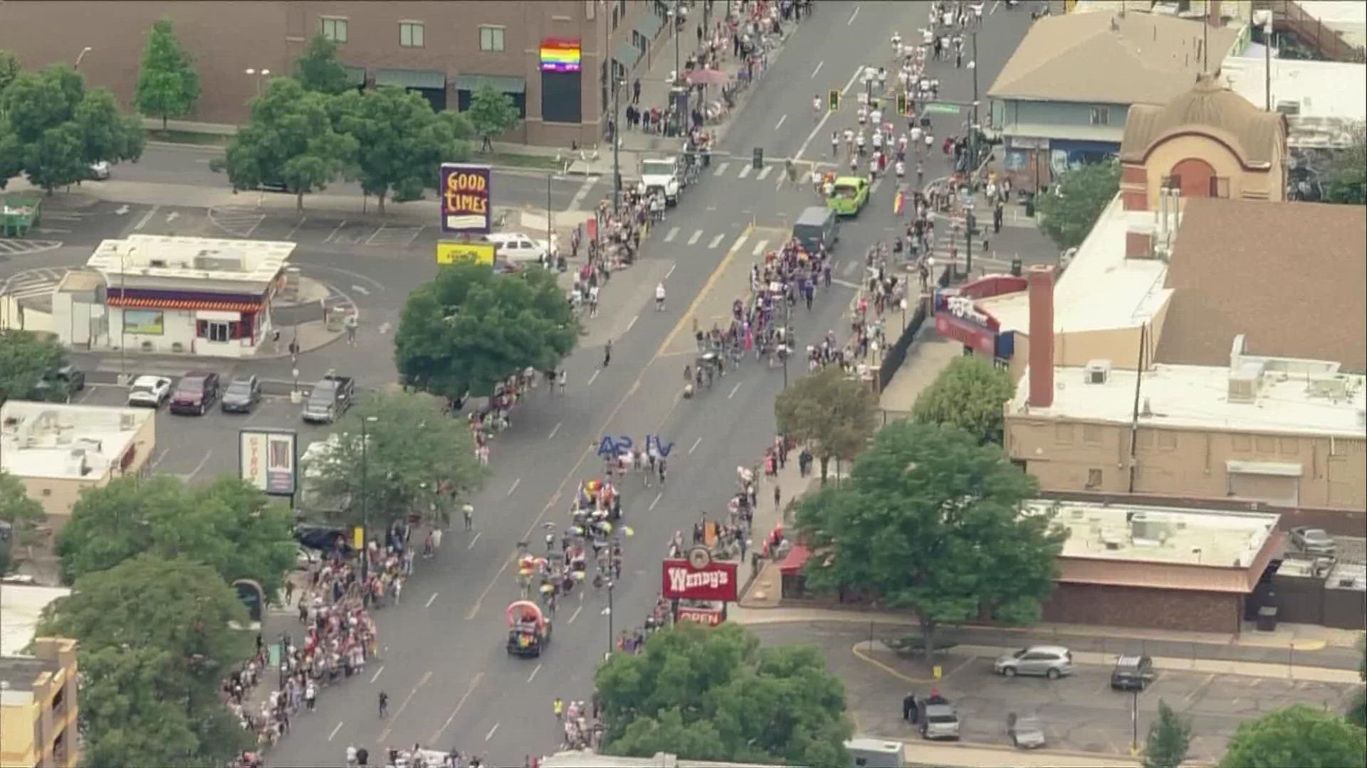 More than 100,000 lined the streets of downtown Denver to cheer on colorful floats, marchers and musicians for Denver Pride on Sunday morning.