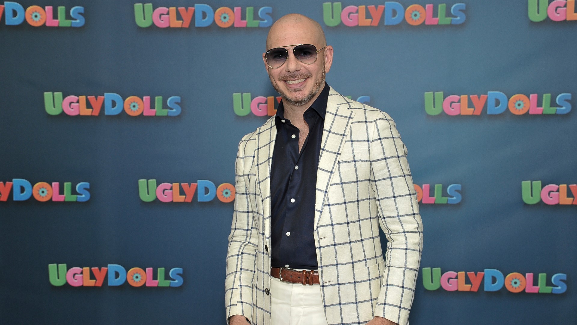 "Due to unforeseen circumstances," Mr. Worldwide will not be playing in the Denver area until September.