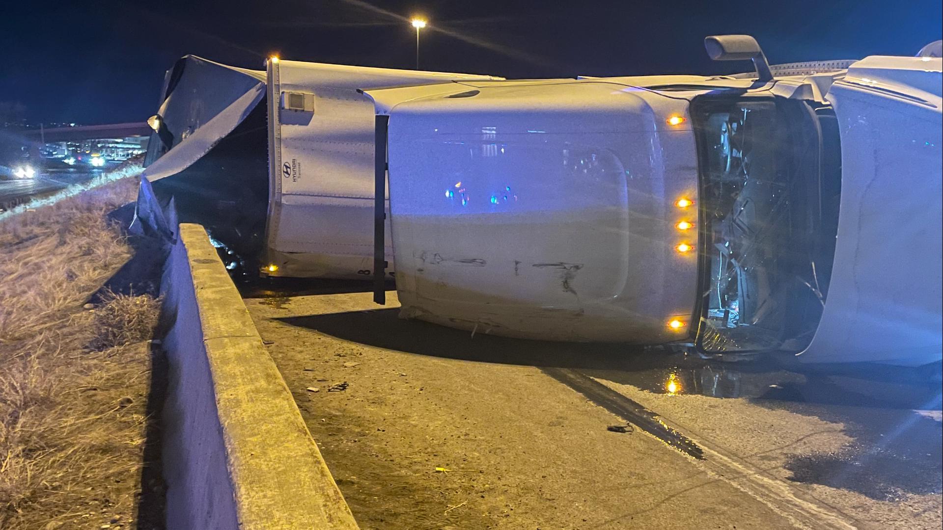 Semi truck rollover spills Coors Banquet beer on I-70 | 9news.com