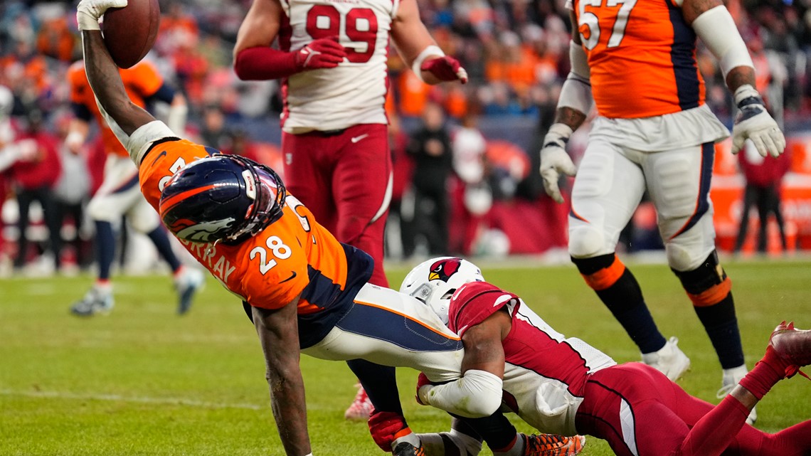 DENVER, CO - DECEMBER 18: Denver Broncos cornerback Pat Surtain II (2) goes  up to grab an interception during an NFL game between the Arizona Cardinals  and the Denver Broncos on December