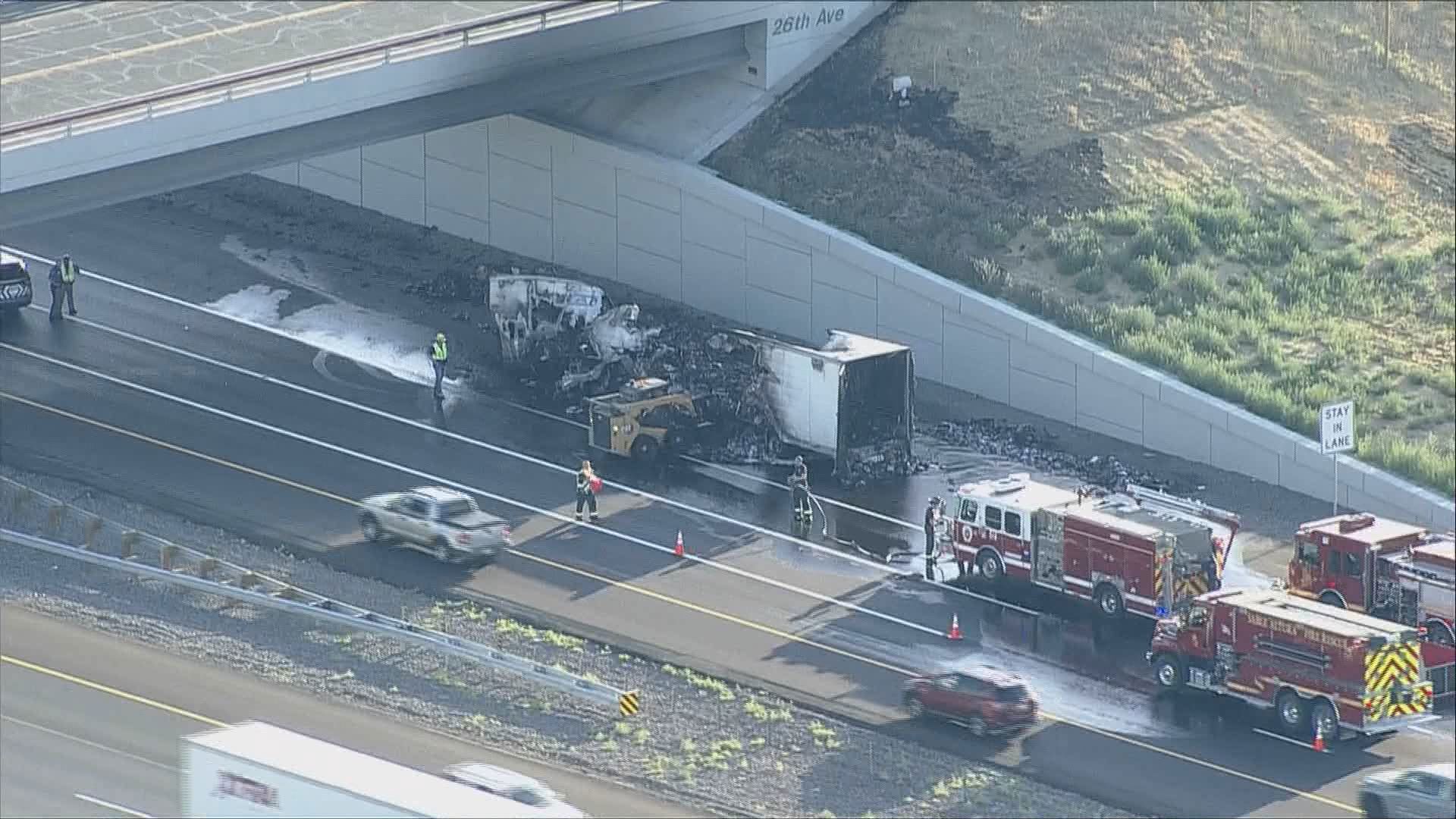 Fire crews clean up a semi-truck fire on E-470 on Monday, July 15, 2024.