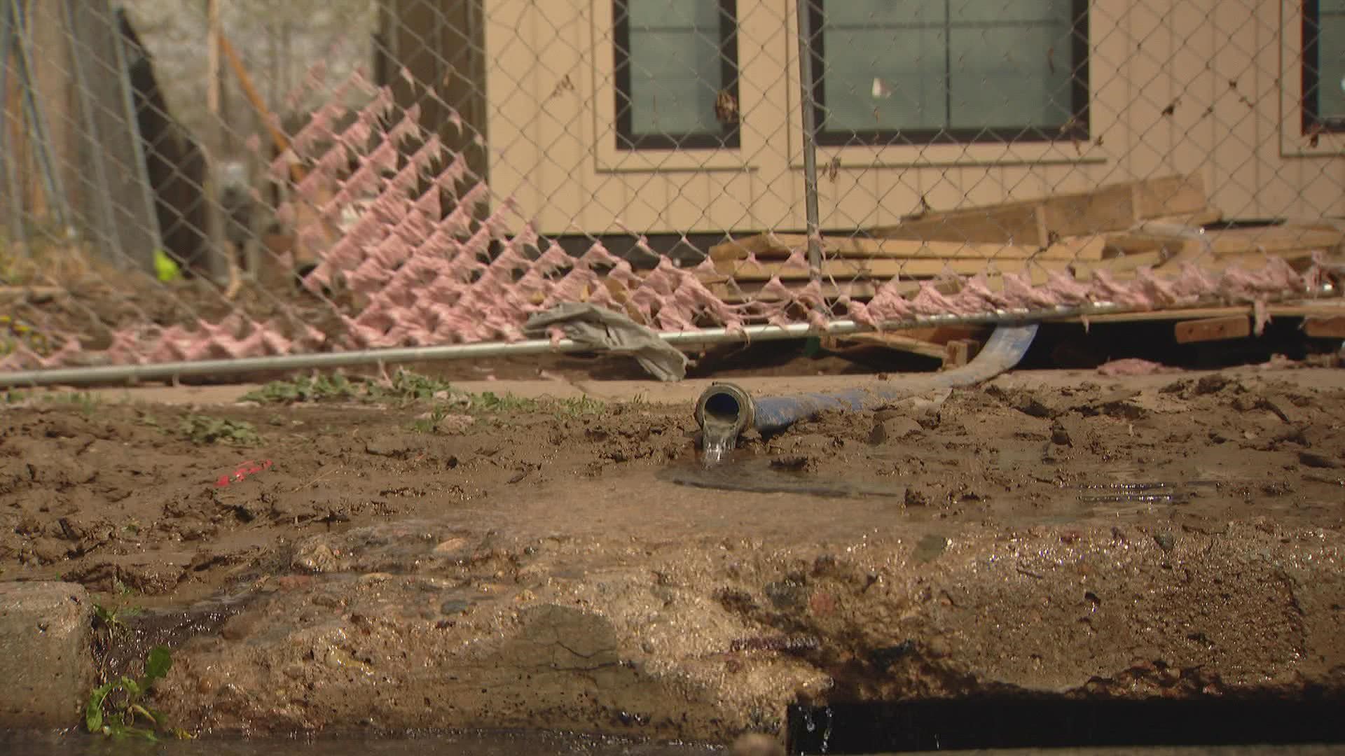 Homeowners in Denver's Berkeley neighborhood spent Monday cleaning up basements and yards after a water main break flooded the streets.