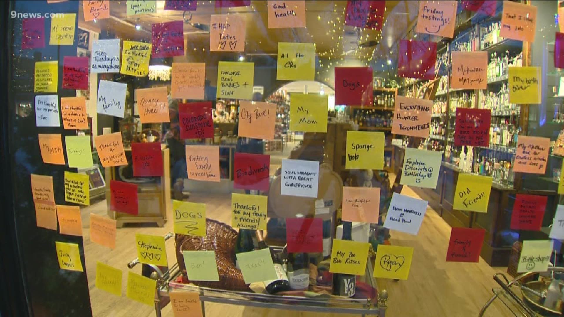 A local liquor store's window has become a conversation starter thanks to dozens of sticky notes.