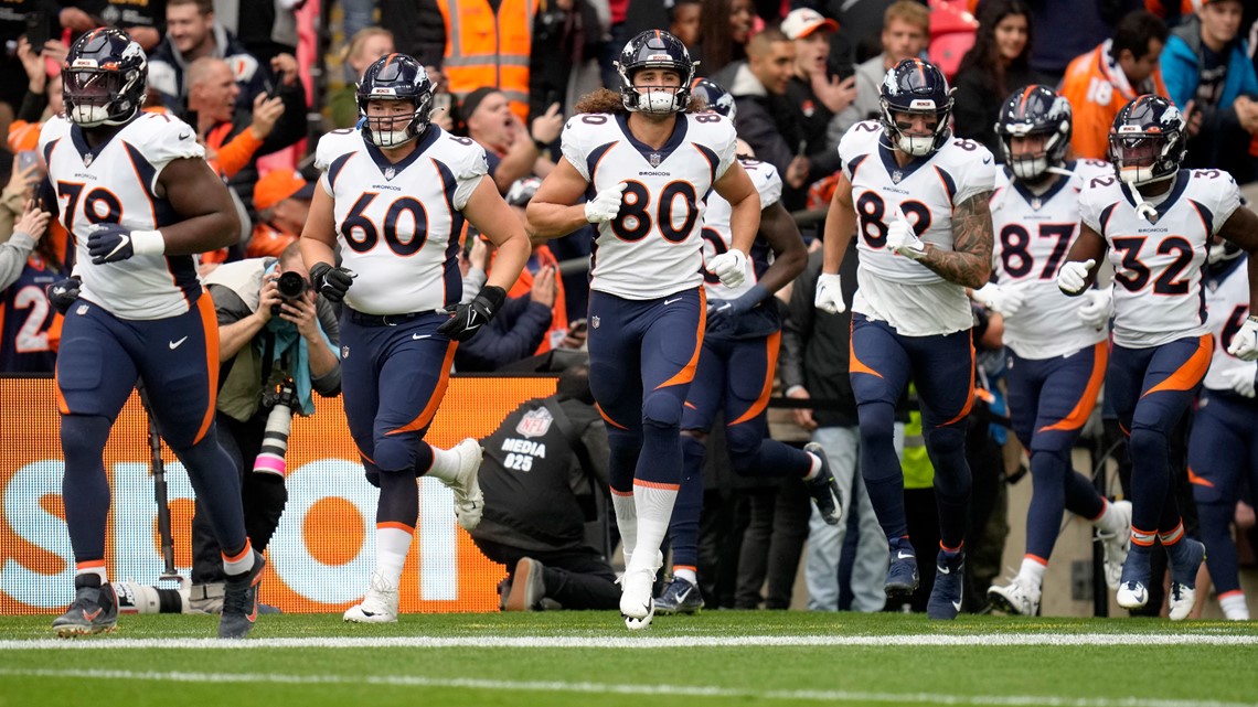 Denver Broncos orange-blue stripe uniform combo returns vs Titans