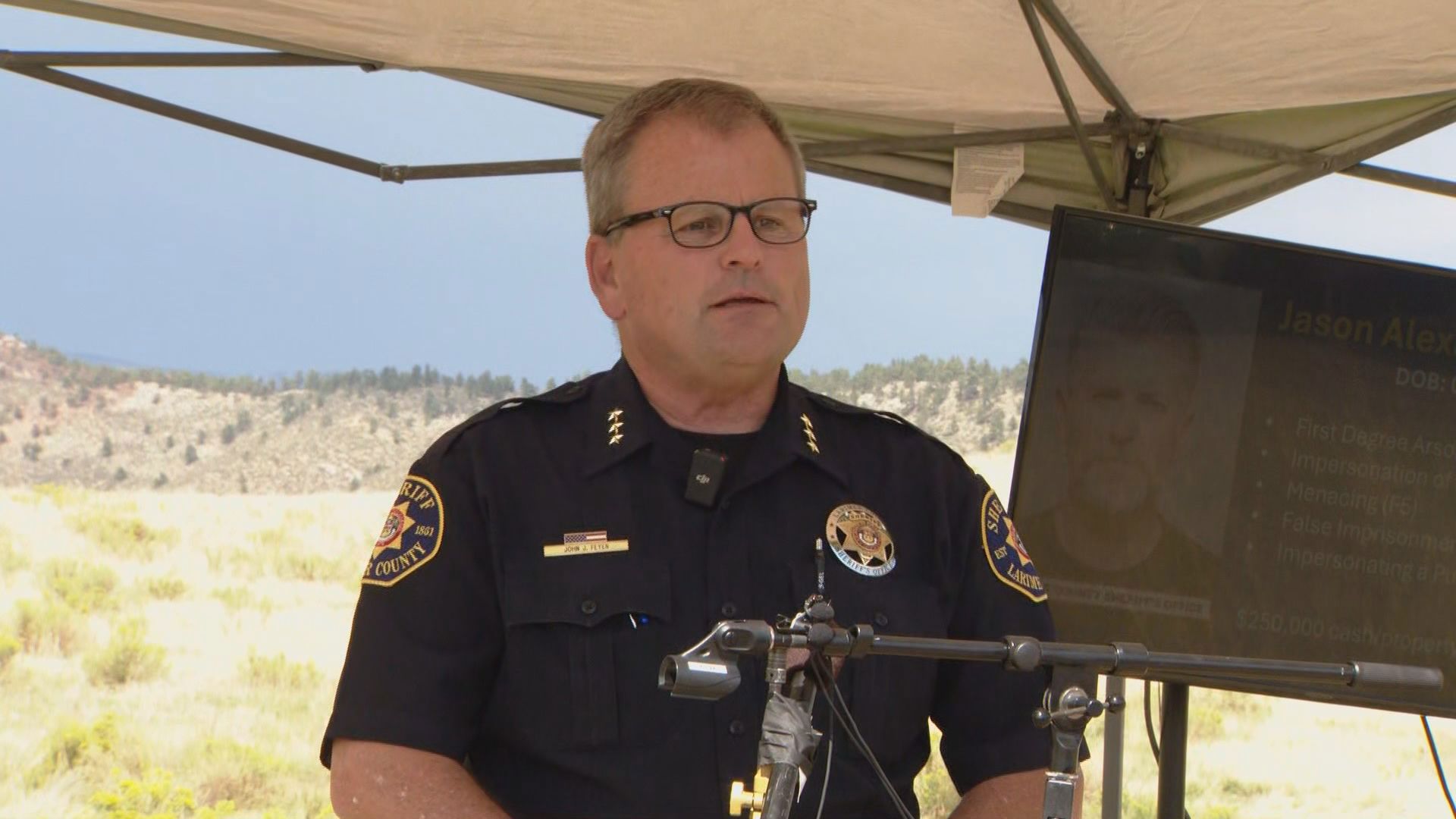 A man has been arrested on arson and other charges in connection with a wildfire that destroyed more than two dozen homes west of Loveland earlier this summer.