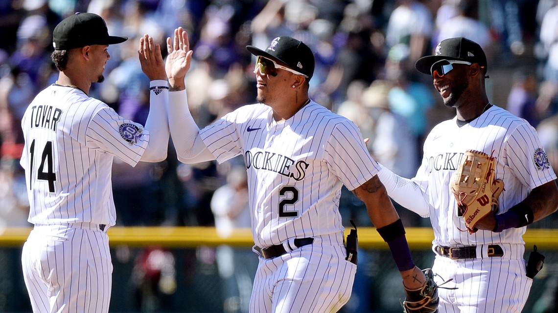 Elias Diaz of the Colorado Rockies celebrates with Brendan Rodgers