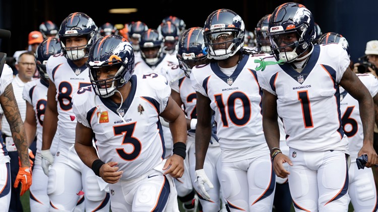 Broncos Russell Wilson greets some Seahawks, 1st fans in boo