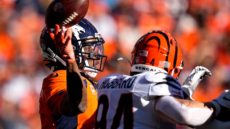 Cincinnati Bengals quarterback Joe Burrow (9) smiles post game against the  Denver Broncos in the second half of an NFL football game Sunday, Dec 19,  2021, in Denver. (AP Photo/Bart Young Stock