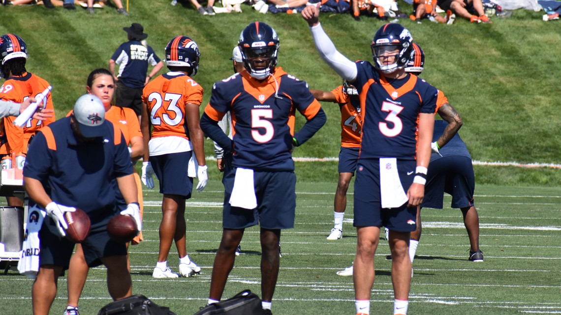 Denver Broncos quarterback Teddy Bridgewater (5) and Denver Broncos  quarterback Drew Lock (3) taking part in drills at an NFL football training  camp at team headquarters Saturday, July 31, 2021, in Englewood