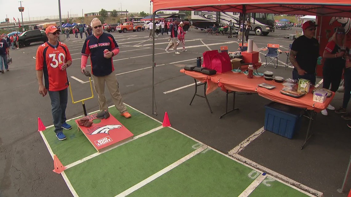 A Denver Broncos Christmas tree is set up as fans tailgate prior