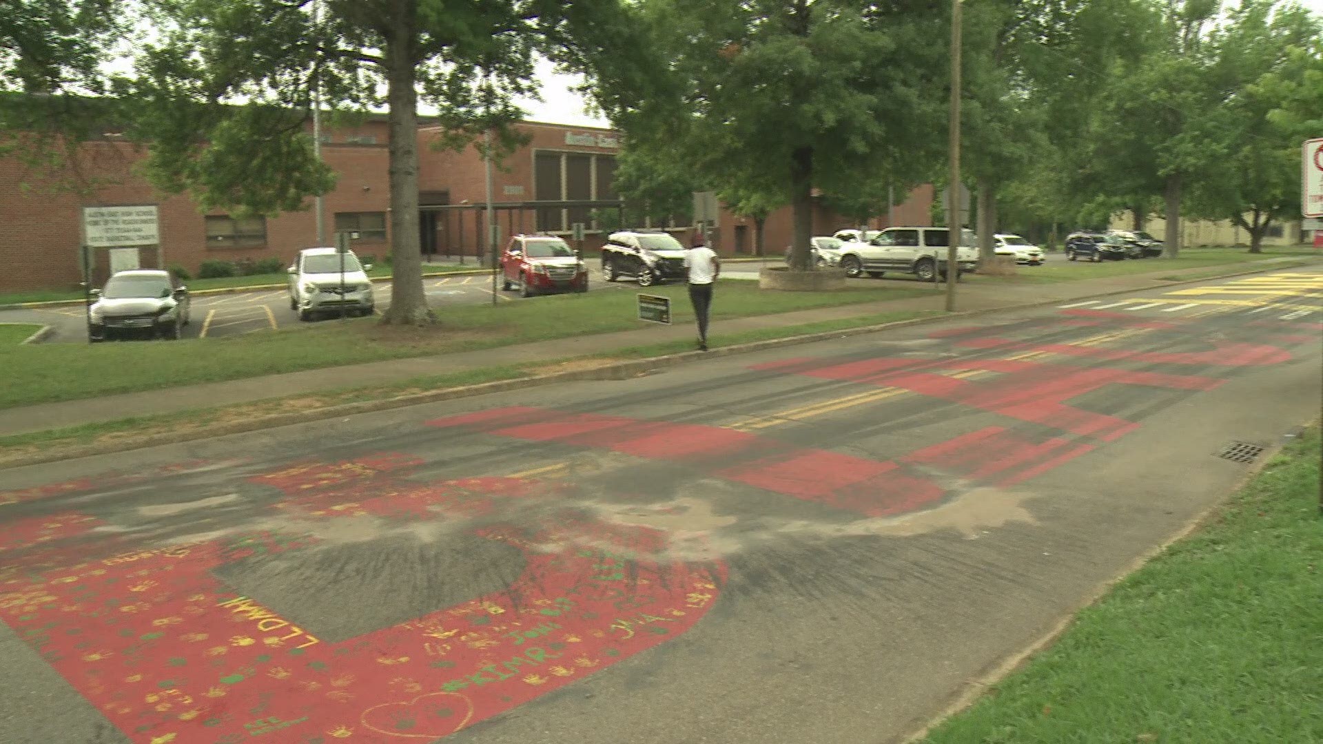 What looks like black paint was poured onto the road where the Black Lives Matter mural is painted in front of Austin-East Magnet High School in Knoxville.