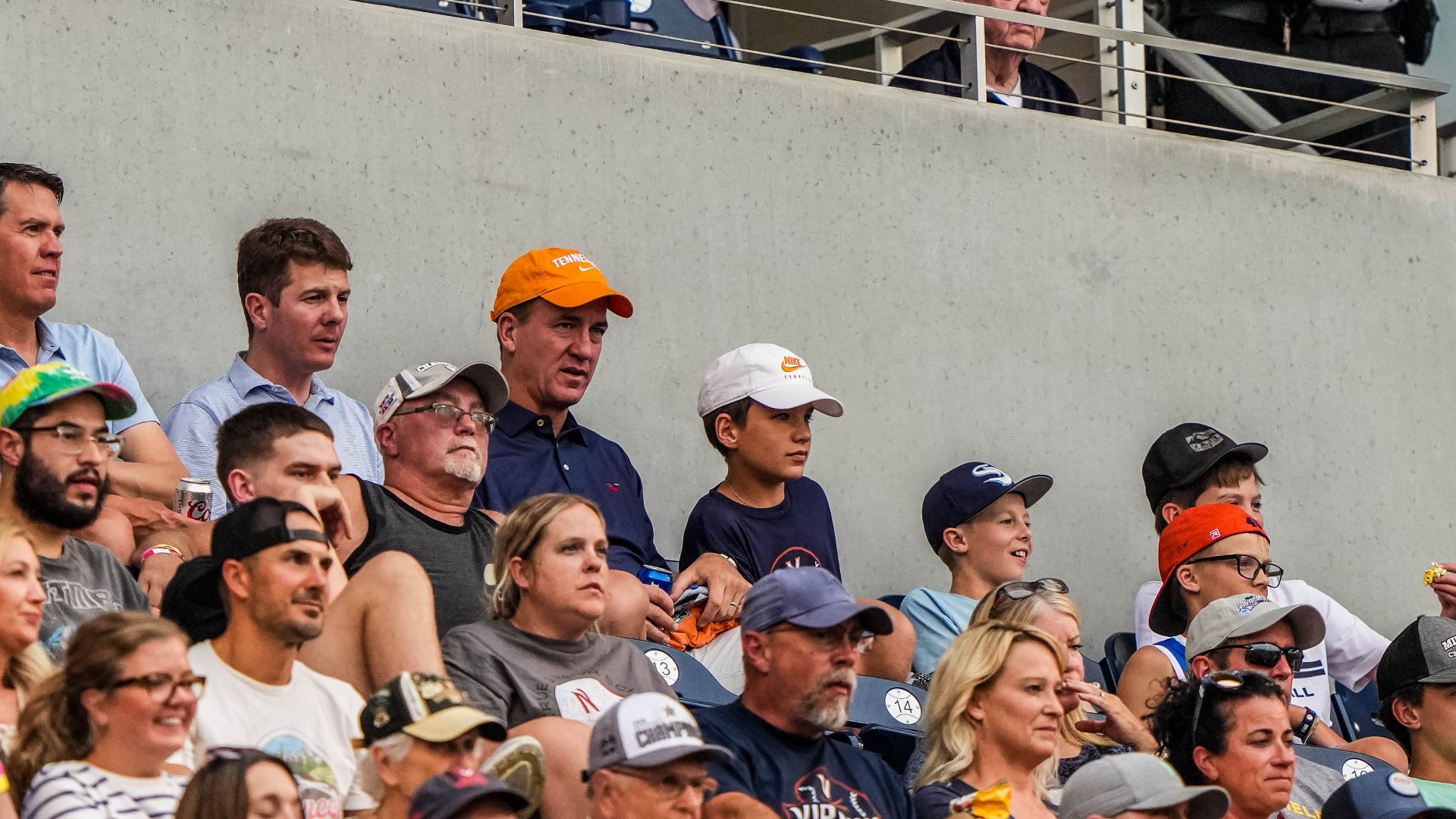 Peyton Manning attending the College World Series
