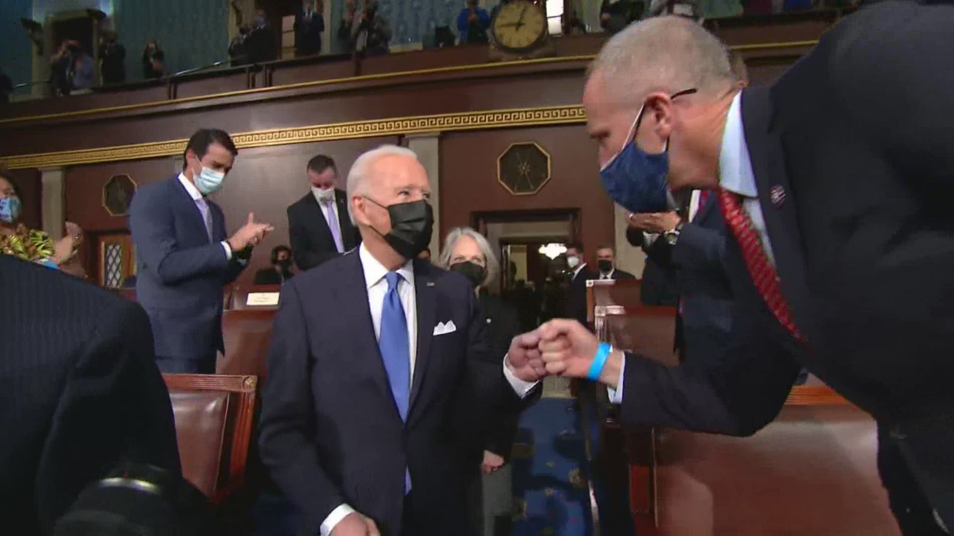 President Joe Biden enters the House chamber to address Congress.