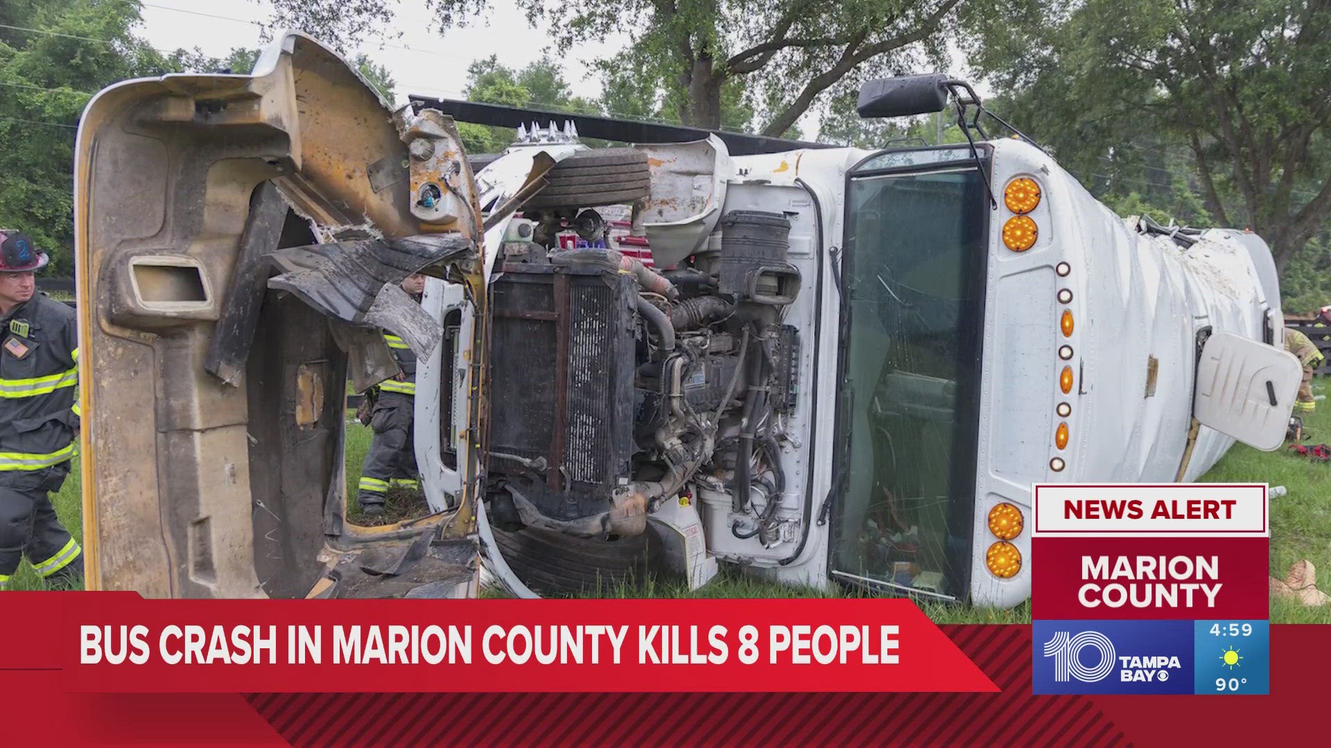 The bus crashed through a fence after colliding with a truck and ended up on its side.