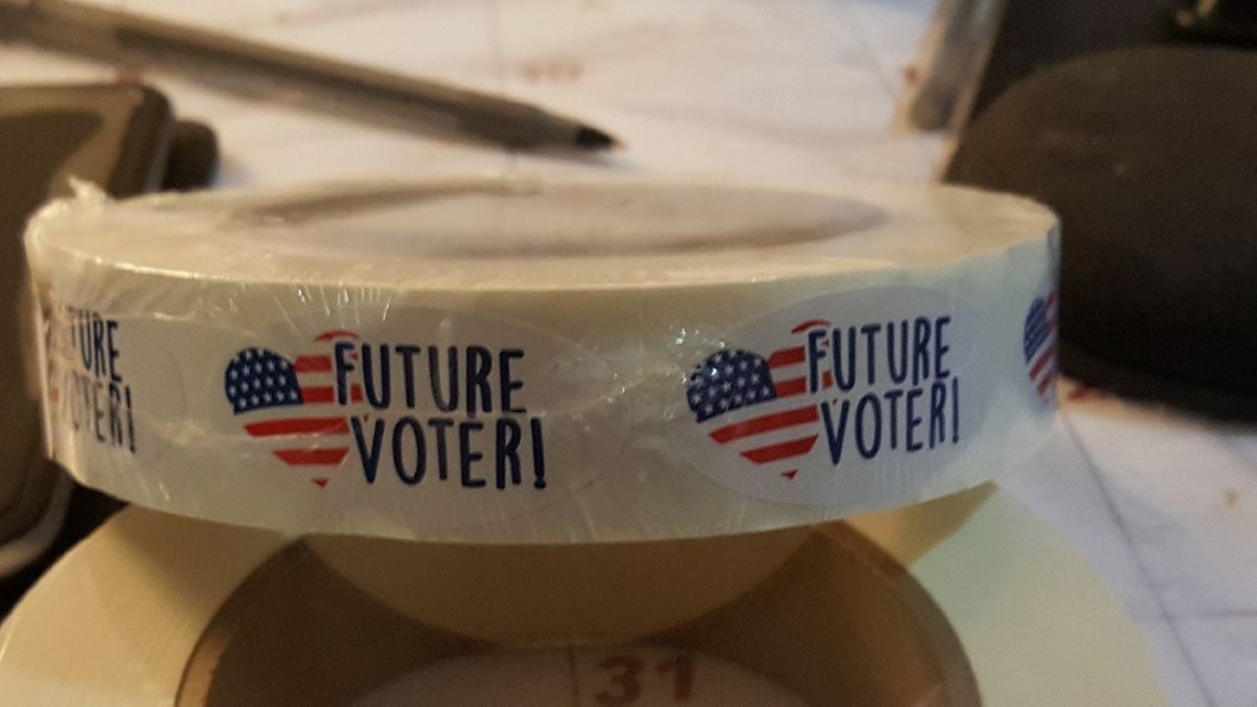 VERIFY: Can you bring your kid, take a photo at Maryland polling ...