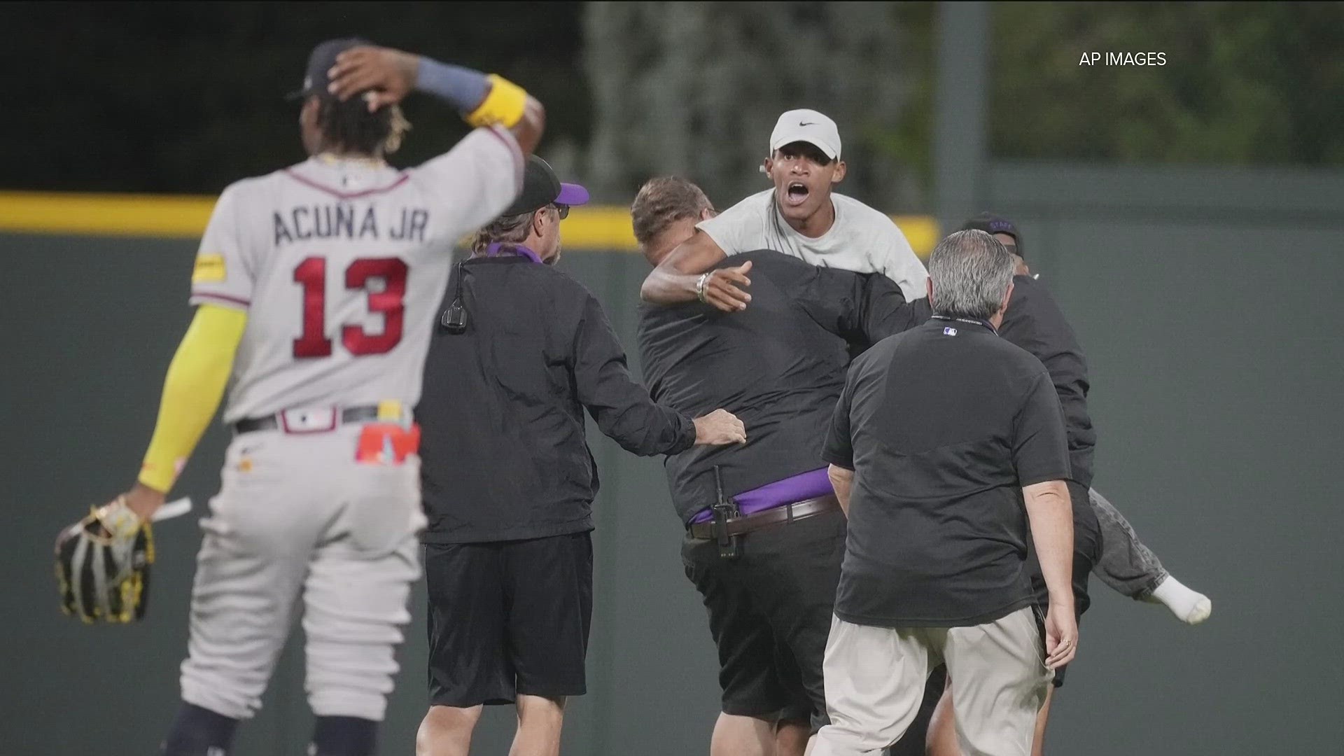 The Atlanta Braves’ game against the Colorado Rockies on Monday was delayed momentarily when two spectators ran onto the field.