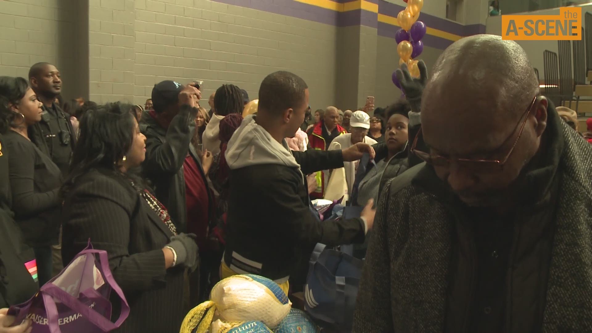 Rapper, activist and actor T.I., a.k.a Clifford Harris, gives out turkeys and other thanksgiving ingredients to his Atlanta community.