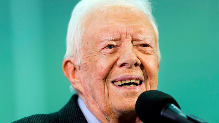 Vaccinated for virus, President Jimmy Carter and wife back in church